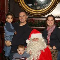 Family of four with Santa Claus
